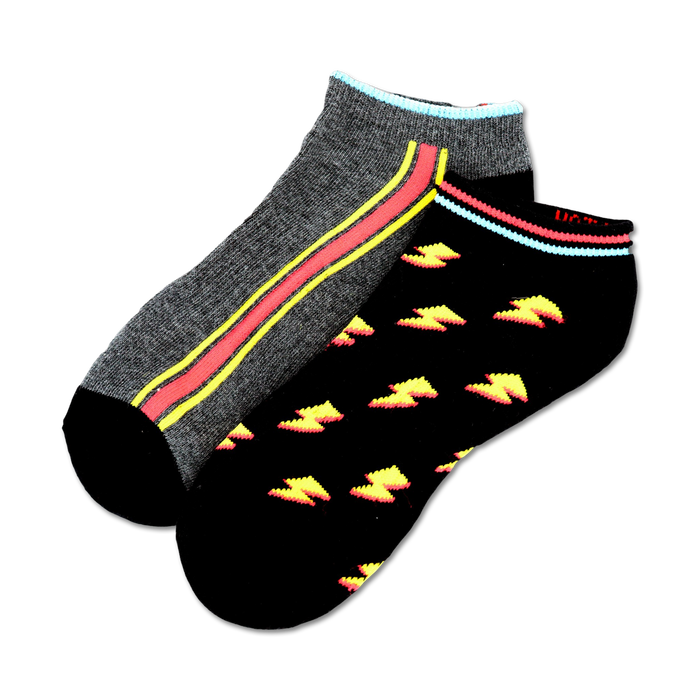 Two pairs of ankle socks. One pair is gray with a pink and yellow stripe, and the other is black with a yellow lightning bolt pattern.