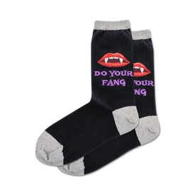 women's do your fang crew sock features a pattern of red vampire lips and sharp white fangs.   
