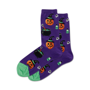 purple crew socks with a halloween pattern. keywords: socks, crew socks, halloween socks, purple socks, spooky socks, funky socks, witch socks, pumpkin socks, cauldron socks, whimsical socks.   