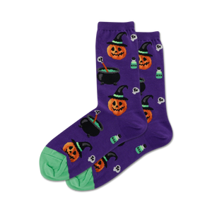 Lifestyle shot showing the purple Witch Pumpkin socks on a person's feet. The socks are styled with a dark colored shoe.
