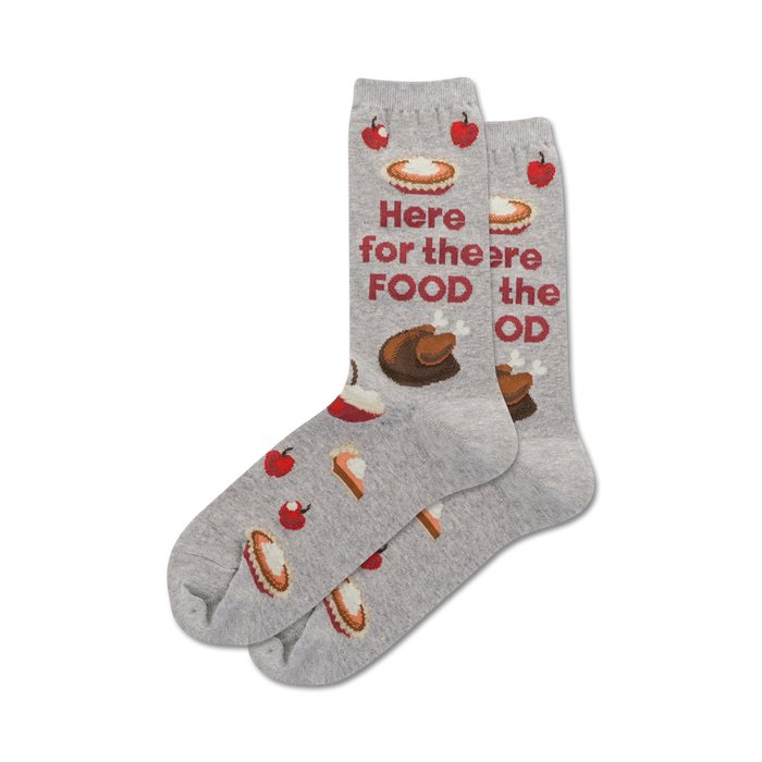 Pair of gray crew socks with Thanksgiving-themed illustrations: pie, turkey, apples, and the text 'Here for the Food'. }}