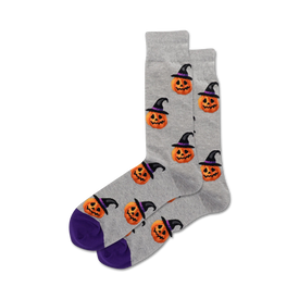 gray crew socks with all-over pattern of cartoon pumpkin heads wearing witch hats; perfect for halloween fun.  