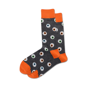 Pair of grey crew socks with orange cuffs and a repeating eyeball pattern. The eyeballs are multicolored with black pupils.