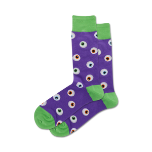 Lifestyle shot of purple Eyeball socks with lime green cuffs. The socks are worn by a model with white sneakers.