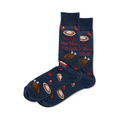 Pair of navy blue crew socks with Thanksgiving-themed designs: turkey, pie slices, apples, and the text 'Here for the food'.