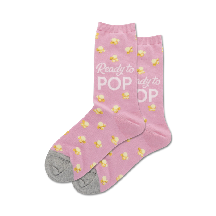pink women's popcorn-patterned crew socks with ready to pop lettering on the front.  