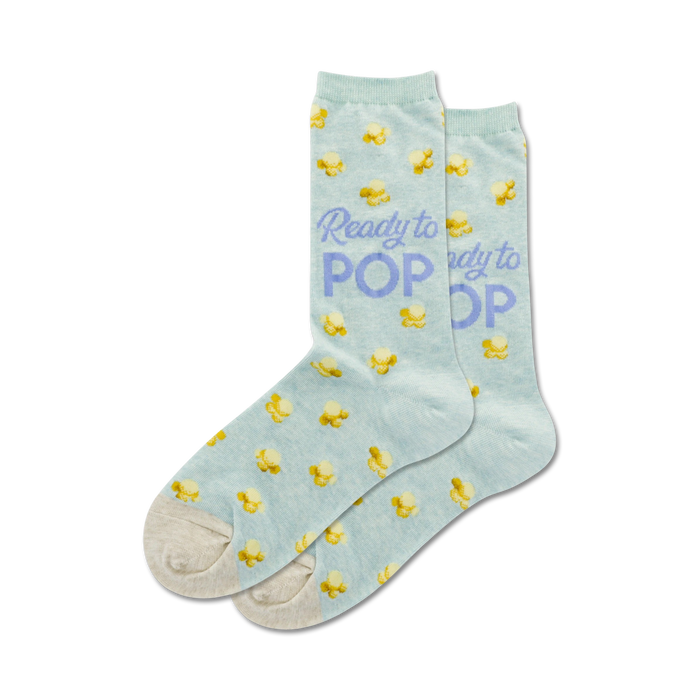 women's ready to pop novelty socks in mint green with a pattern of yellow popcorn kernels and the words 