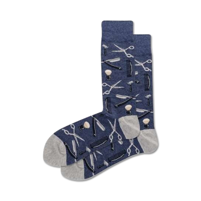 Pair of navy blue crew socks with a pattern of barber tools (scissors, razors, combs) in white and grey.