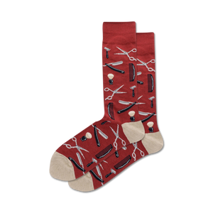 red and tan crew socks decorated with a pattern of silver and black straight razors, shaving brushes, open and closed scissors.  