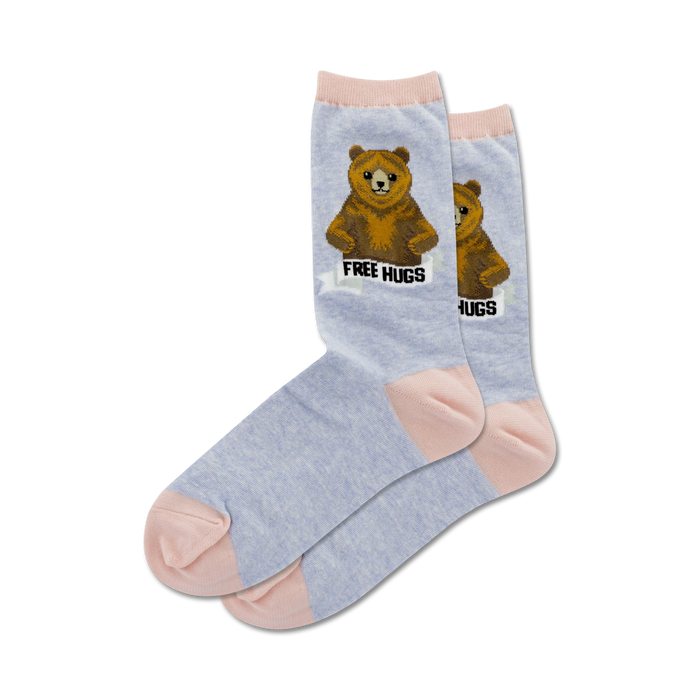 light blue socks with pink toe, heel, and cuff. brown bear with arms outstretched and 'free hugs' on chest. women's crew socks.   