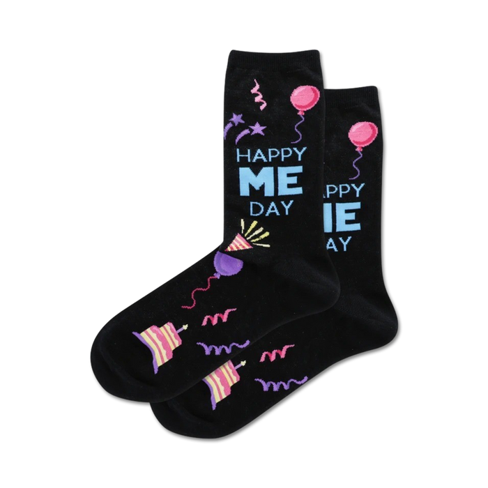 A pair of black crew socks with a 'Happy Me Day' theme. Features colorful birthday-themed designs including balloons, cake, and party hats. }}