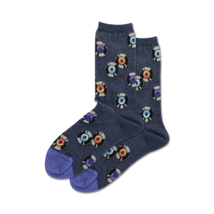 Pair of crew socks, navy blue with multicolored vinyl record designs, purple heel and toe.