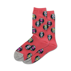 Lifestyle shot showing coral colored 'Records' socks with grey heel and toe. The socks feature a fun pattern of multicolored vinyl records.