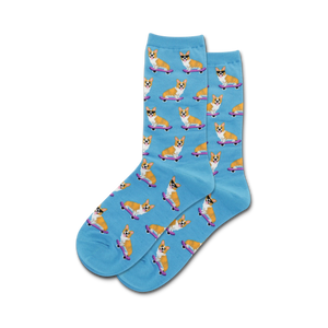 A pair of light blue crew socks with a repeating pattern of corgis wearing sunglasses and skateboarding on purple skateboards.
