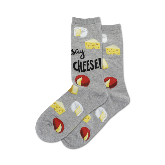 A pair of grey crew socks with illustrations of different types of cheese and the text 'Say Cheese!' printed on them. }}
