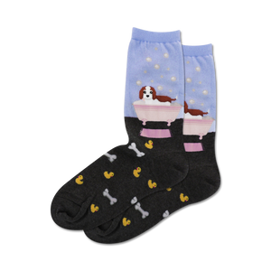 Crew socks in light blue and dark grey. Feature a Cavalier King Charles Spaniel in a bathtub with bubbles, and a pattern of rubber duckies and bones.