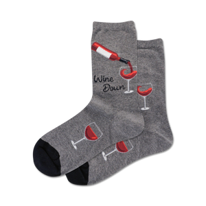 Pair of crew socks in grey and navy blue.  Design features wine bottles pouring into glasses and the text 'Wine Down'.