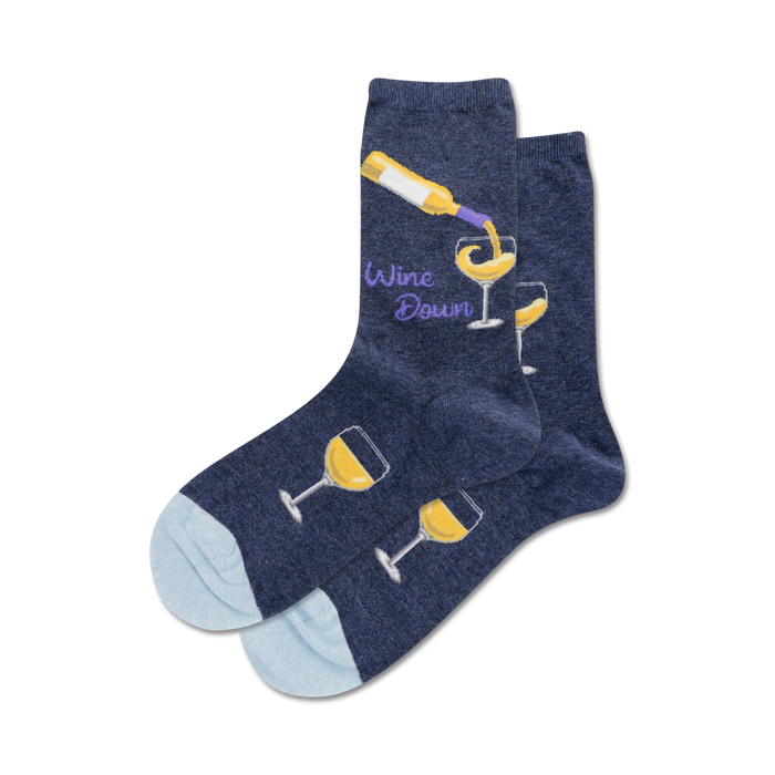 Close-up showing a navy blue pair of 'Wine Down' socks with a white wine design. The socks have a light blue heel and toe.