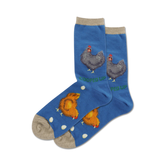 Lifestyle shot of 'Cooped Up Fuzzy' socks on a model's feet. The socks are blue.