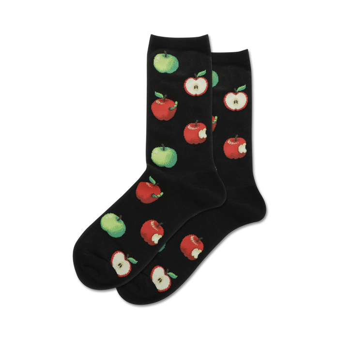Pair of crew socks in black featuring a pattern of red and green apples, some with bites taken out.