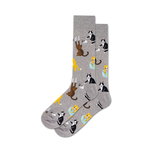 Pair of crew socks in grey and blue, featuring a repeating pattern of cute cats drinking from coffee cups and hanging off mugs.