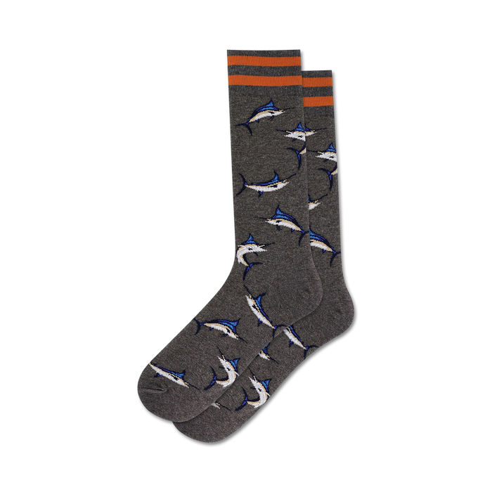 Pair of charcoal gray crew socks with orange stripes and a repeating pattern of blue and white marlin fish. }}