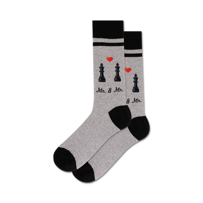 Lifestyle shot showing the grey and black Mr. & Mrs. socks on a model's feet.