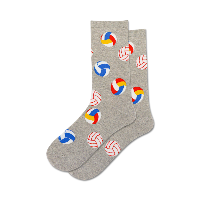 Pair of grey crew socks with colorful volleyball designs. Red, blue, white, and yellow volleyballs are scattered on a heather grey background. }}