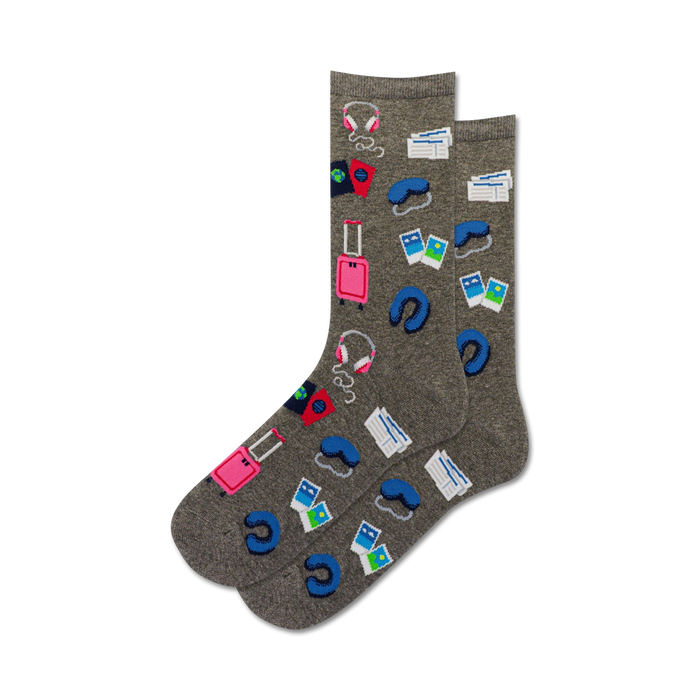 Pair of gray crew socks with colorful travel icons: suitcase, passport, headphones, sleep mask.  Perfect for wanderlusters!