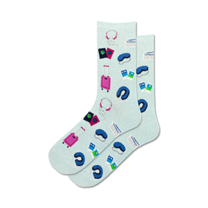 Lifestyle shot: A person's feet wearing the light blue Travel Musts socks.