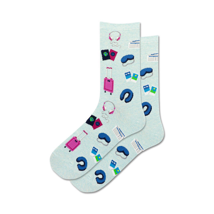Lifestyle shot: A person's feet wearing the light blue Travel Musts socks.
