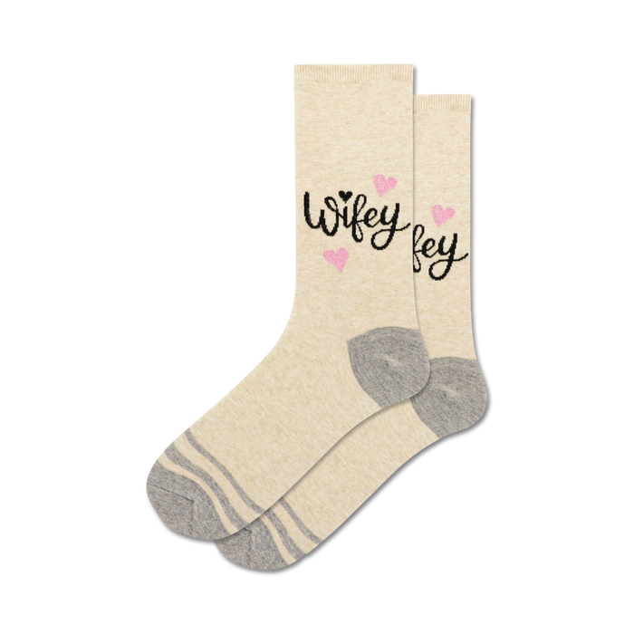 Pair of cream crew socks with a black 'Wifey' script and pink glitter hearts. Gray stripes at the cuff. }}