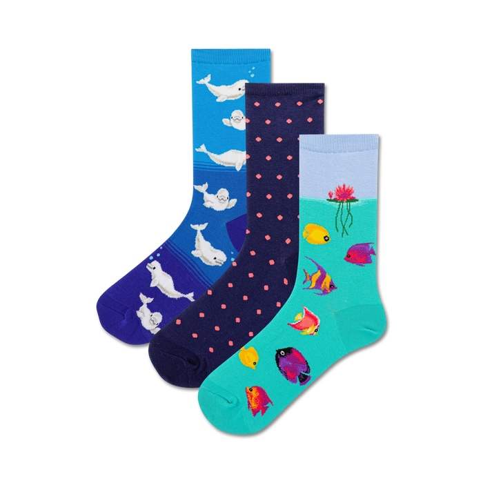 Three crew socks: one blue with beluga whales, one navy with pink polka dots, one teal with colorful fish and a water lily. }}