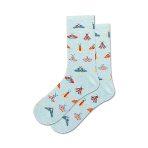 Lifestyle shot showing a pair of light blue crew socks with a moth pattern on a neutral background.