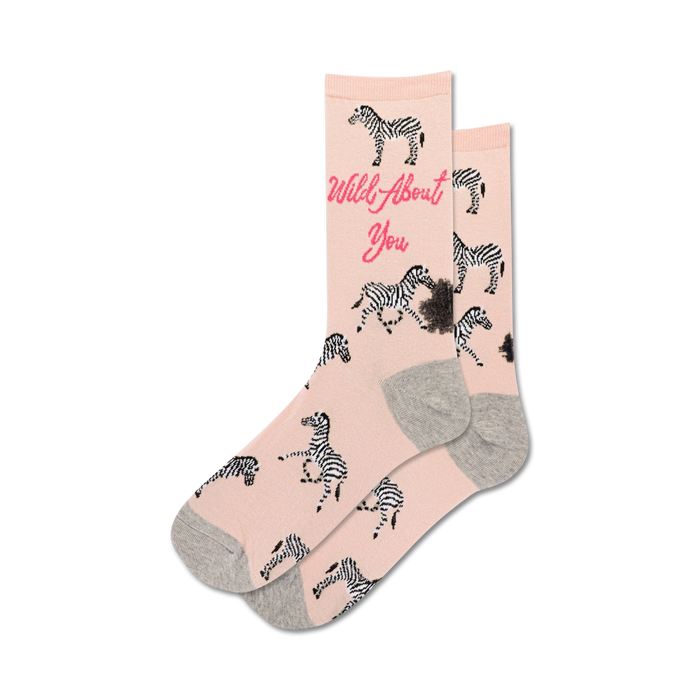 crew-length pink socks with black and white zebra pattern, gray toes and heels, and 