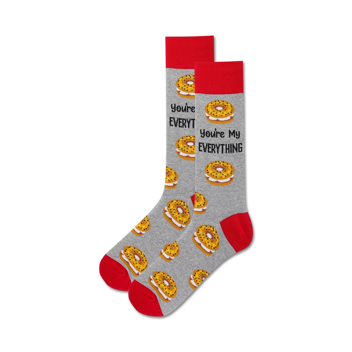 Pair of grey crew socks with red cuffs. Features a pattern of everything bagels and the text 'You're My Everything'. }}