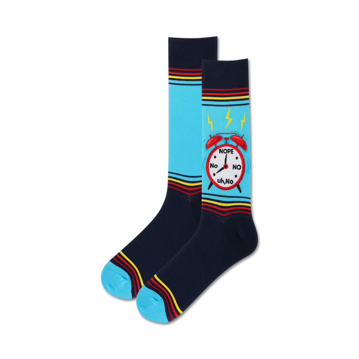 Pair of crew socks. Navy blue with light blue sections and colorful stripes. Features a graphic of a red alarm clock that says 'Nope' and 'No'. }}