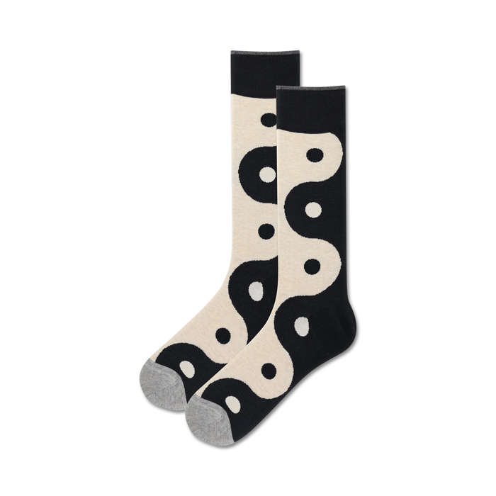 Pair of cream and black crew socks featuring a repeating yin yang pattern. A stylish and comfortable choice for everyday wear. }}