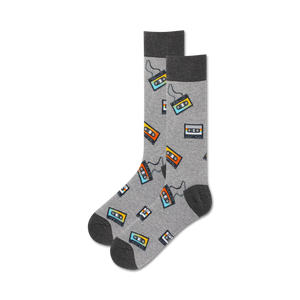 Pair of crew socks in gray with a repeating pattern of colorful cassette tapes.