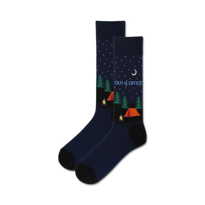 dark blue men's crew socks with a camping theme, white crescent moon, stars, pine trees, tent and campfire. 