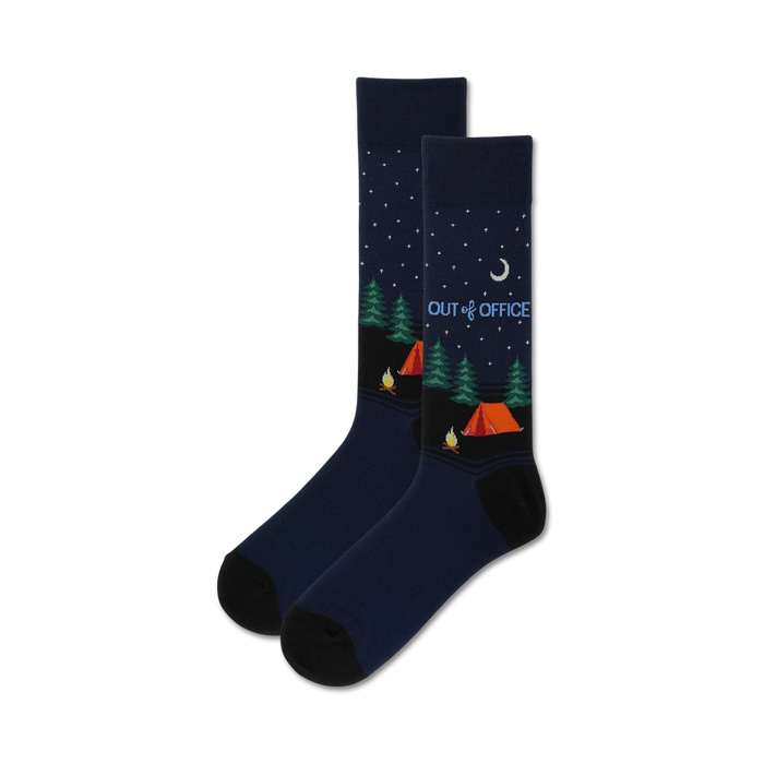 Pair of navy blue crew socks with a whimsical camping scene at night, including orange tent, green trees, and a crescent moon. }}