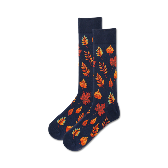 mens crew autumn leaves novelty socks in navy blue with orange teal red and green.   }}
