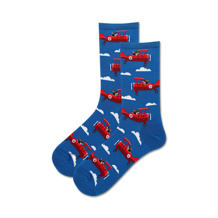 A pair of crew socks in blue featuring a repeating pattern of red airplanes piloted by dogs. }}