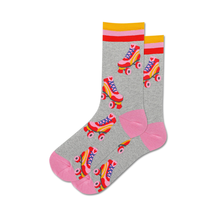 gray crew socks with pink and blue roller skates. pink top with two yellow and one red stripe. pink bottom.  