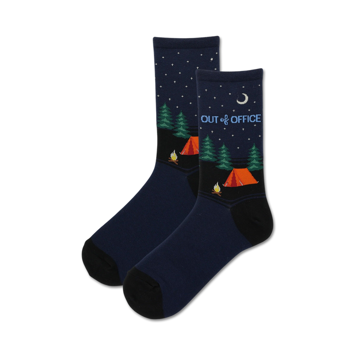 Pair of navy blue crew socks with a camping scene, orange tents, green trees, and stars at night. Text reads 'Out of Office'. }}