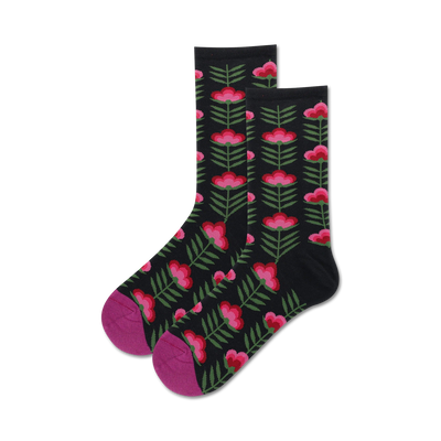 Pair of black crew socks with a retro pink and green floral pattern.  Features a magenta-colored toe and heel.