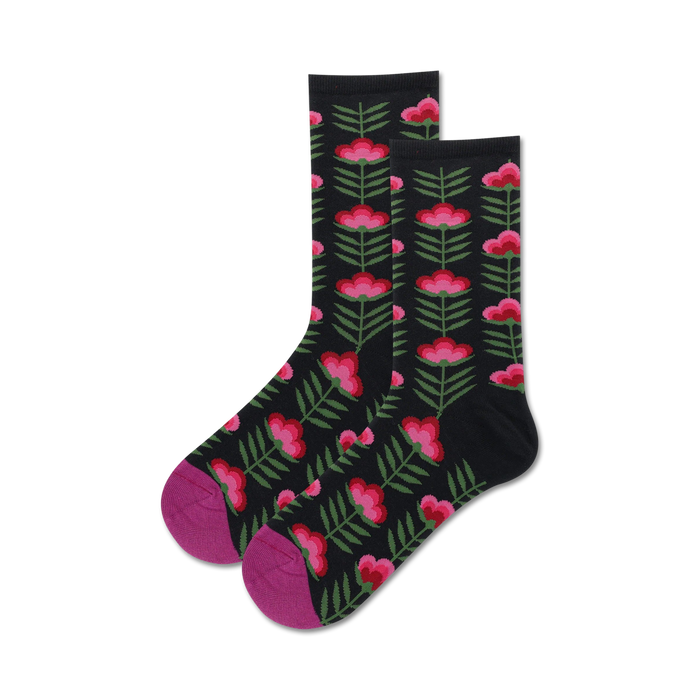 Pair of black crew socks with a retro pink and green floral pattern.  Features a magenta-colored toe and heel.
