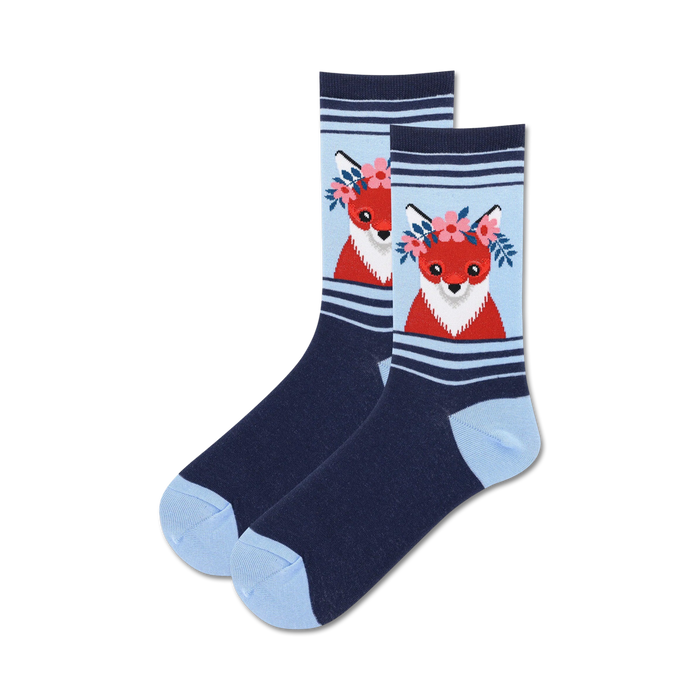 Pair of crew socks in navy blue and light blue, featuring a red fox wearing a flower crown.  Cute and whimsical design.
