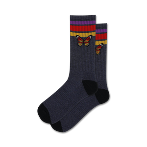 dark gray women's crew socks with an eye-catching pattern of orange, yellow, and red butterflies with black outline highlighted with red, yellow, and purple stripes on dark gray at the top.  