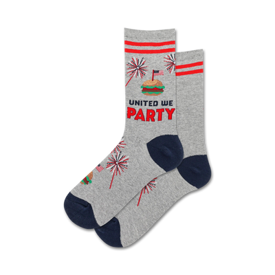 Pair of grey crew socks with red and navy blue accents. Design includes fireworks, a hamburger, and the phrase 'United We Party'.